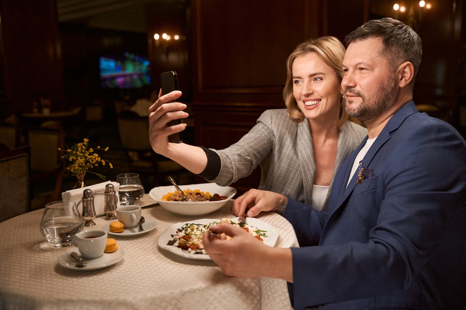 Couple Taking a Selfie While Dining Together in Restaurant